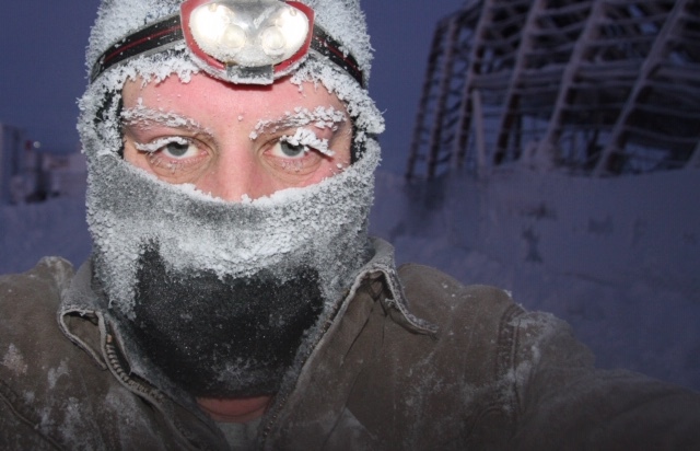 Craig Rice investigating cold fire scene in Northern Alaska